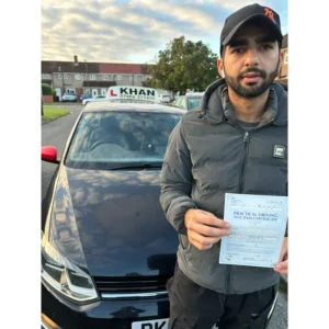 Learner driver celebrating passing their driving test with Khan School of Motoring