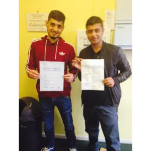 Learner driver celebrating passing their driving test with Khan School of Motoring