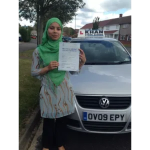 Learner driver celebrating passing their driving test with Khan School of Motoring