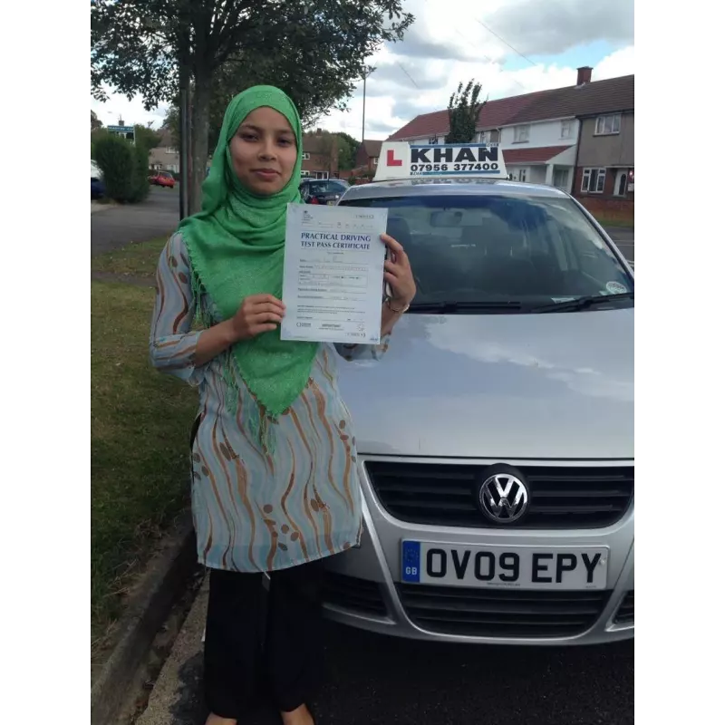 Learner driver celebrating passing their driving test with Khan School of Motoring