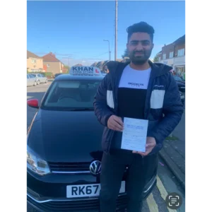 Pupil proudly showing pass certificate after driving lessons