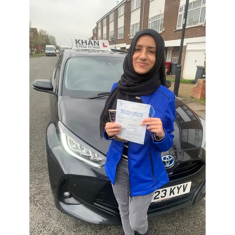 New driver celebrating first time pass after professional driving lessons