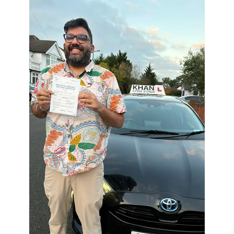 Learner driver celebrating passing their driving test with Khan School of Motoring
