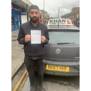 New driver celebrating first time pass after professional driving lessons
