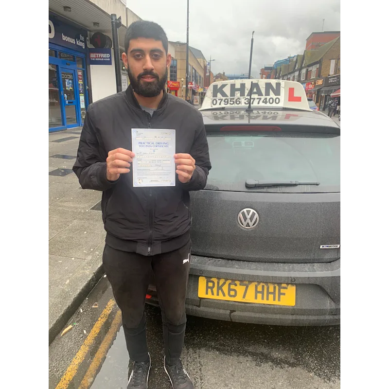 New driver celebrating first time pass after professional driving lessons